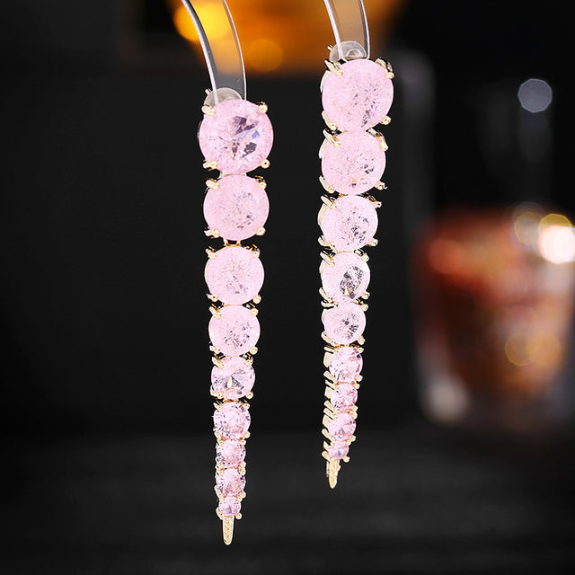 Aretes colgantes dorados