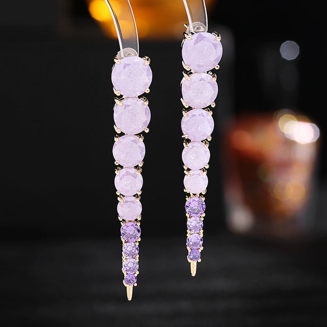 Aretes colgantes dorados