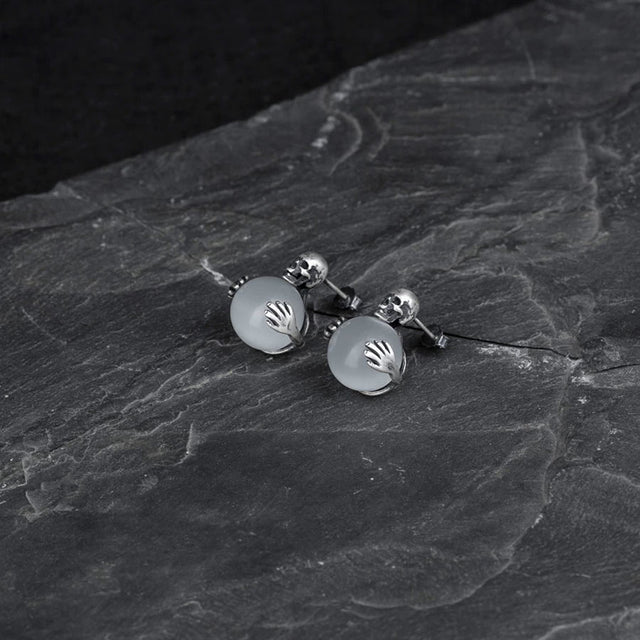 Aretes de calavera con ojo de gato