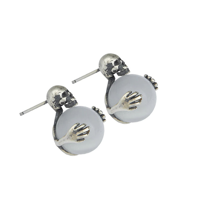 Aretes de calavera con ojo de gato